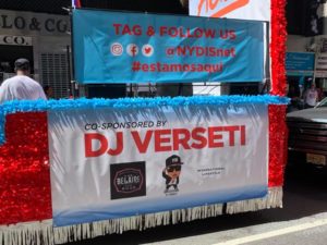 The Side of the NYDIS Float Complete with Social Media Handles and Co-Sponsorship Info on DJ Verseti
