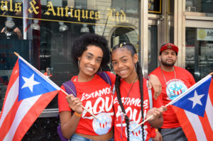 Two Young Marchers Pose for a Photograph with their "Estamos, Aquí" T-Shirts